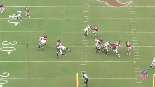 Kelce uses his whole body to cut block the linebacker and take him out of the play. 