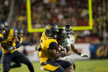 Nelson makes a tackle on a California Golden Bears punt returner in one of his appearances on defense last season.
