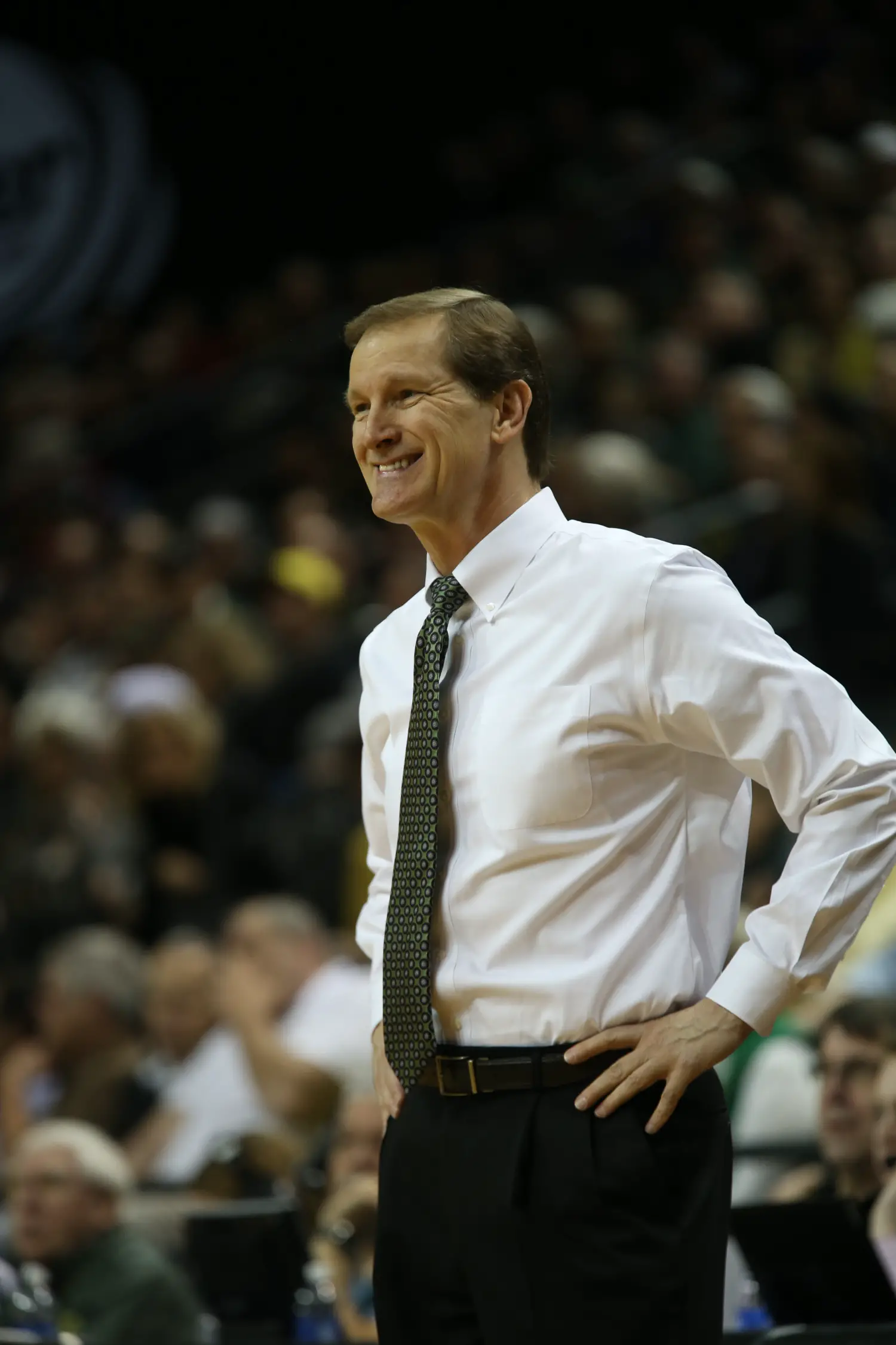 Head coach Dana Altman does something he rarely does in a game: smiles. 