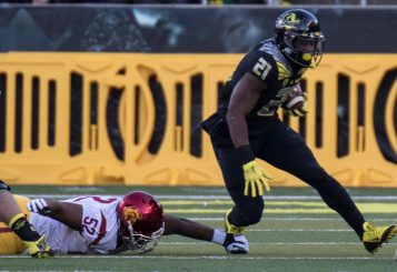 Royce Freeman and the Ducks flattened the Trojans, who nonetheless will play for the Pac-12 title.