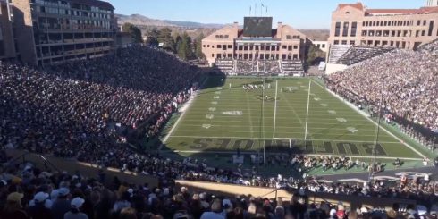 Photo of a packed Colorado University football stadium.