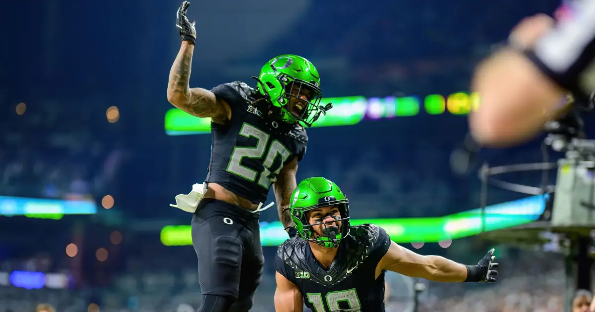 Kenyon Sadiq and Jordan James celebrate in the B1G Championship 2024 - FishDuck.com in Eugene, OR - College Football Playoff - Oregon Football